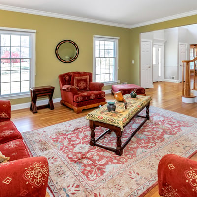 The elegant Living Room
features crown molding and hardwood flooring.