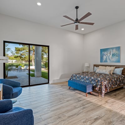 Elegant main bedroom with sliding doors to patio and pool access combines indoor comfort with outdoor Scottsdale living.