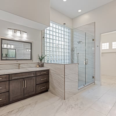 A spa-style primary bath with expanded vanity, glass shower, and modern finishes elevates this Scottsdale home.