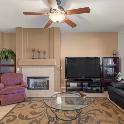 A perfect blend of spaciousness and comfort, this great room features abundant light, tile flooring, and neutral finishes ideal for both relaxation and entertaining.