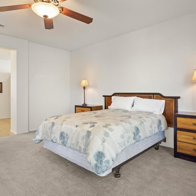 This bright and spacious primary suite combines comfort and function, with direct access to the ensuite bath and generous natural lighting.