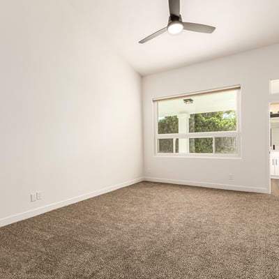 Spacious primary bedroom with high ceilings, plush carpet, and generous natural light. The peaceful Scottsdale setting offers a relaxing retreat with easy access to the updated ensuite bathroom.