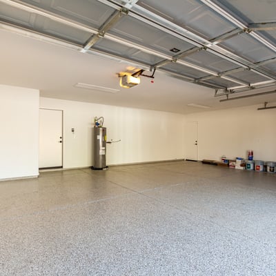 Expansive three-car garage offering plenty of room for vehicles, storage solutions, and workspace. The Scottsdale garage features a clean finished floor and direct access to the home for everyday convenience.