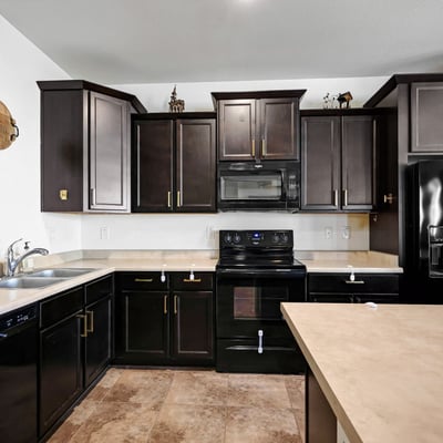 Kitchen storage highlighted by plentiful cabinetry and functional counter space, supporting organized and efficient meal prep.