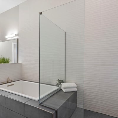 Contemporary spa-style bathroom featuring clean lines, premium tilework, and a spacious walk-in shower.