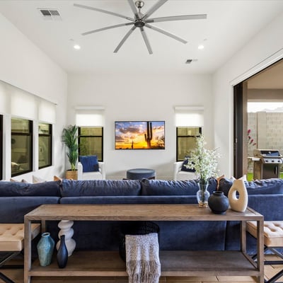Living room with large sliding glass doors opening to the covered patio, creating true indoor-outdoor living. Designed for entertaining and enjoying Scottsdale s climate.