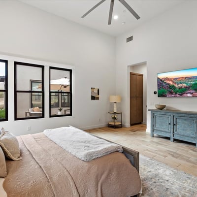 Tranquil primary suite with high ceilings and refined finishes, offering a comfortable retreat within this Scottsdale luxury property.