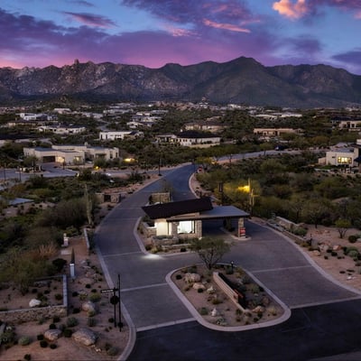 Daytime aerial of the Sereno Canyon guard-gated entrance emphasizing privacy, security, and upscale access within this Scottsdale luxury community.