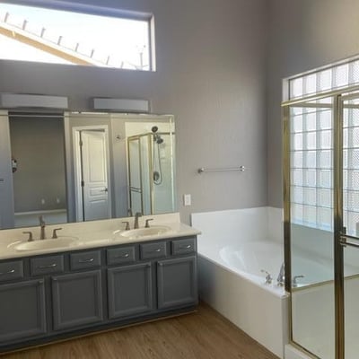 Spa-style primary bath with soaking tub, walk-in shower, and dual vanities. Designed to balance everyday convenience with a relaxing atmosphere.