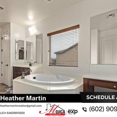 Featuring an extended vanity with dedicated makeup space and a large soaking tub, this primary bath blends style and functionality in this beautifully maintained Glendale home.