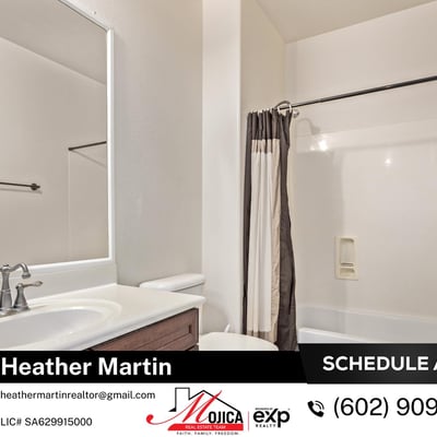 This secondary bathroom offers a full tub and shower combo, spacious vanity, and warm cabinetry for added storage. Neutral tile and updated fixtures complement the move-in-ready design of this Glendale home.