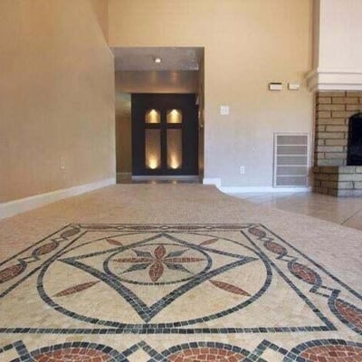 Elegant mosaic tile design at the front entry creates a unique welcome to this Glendale home. The decorative flooring adds character and visual interest to the interior space.