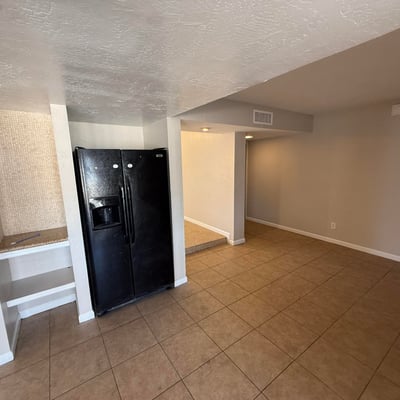 Kitchen and dining area with tile floors and smooth flow to surrounding living spaces. The open layout makes everyday meals and gatherings easy in this Glendale home.