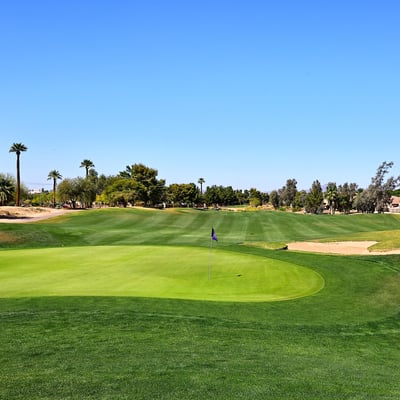 Golf course featuring pristine greens, sand bunkers, and open fairways. This Phoenix community offers a scenic and active outdoor lifestyle.