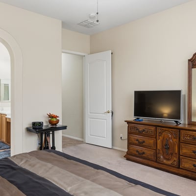 Well-sized primary suite with easy access to ensuite bath, providing comfort,