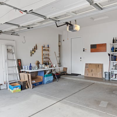 Spacious garage offering room for vehicles, tools, and storage, providing versatility and practicality in this Phoenix property.