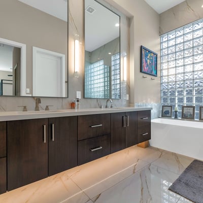 Luxurious bathroom featuring a soaking tub, dual sinks, and modern finishes, creating a relaxing spa-like atmosphere in Phoenix.