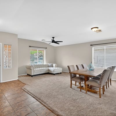 Large living and dining space with high ceilings and natural light. Flexible layout supports entertaining and comfortable living in Casa Grande.