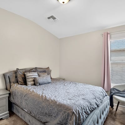 Secondary bedroom offering comfort, natural light, and versatility. Ideal for guests or family in this Casa Grande property.