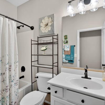 Full bathroom featuring a tub and shower combo with clean finishes. Designed for functionality and ease in Casa Grande.