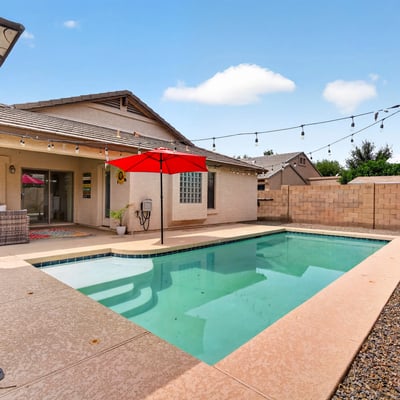 Backyard retreat with pool, patio, and easy-care landscaping. Ideal for relaxing or entertaining in this Casa Grande home.