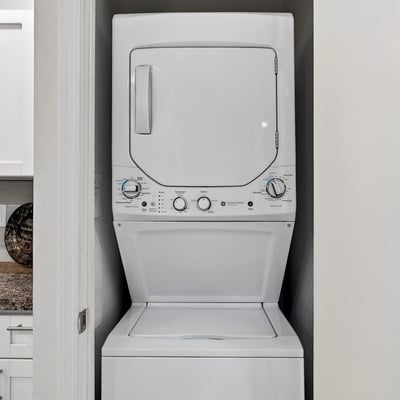Efficient Scottsdale laundry area with stacked washer and dryer, offering convenience and practicality within the home.