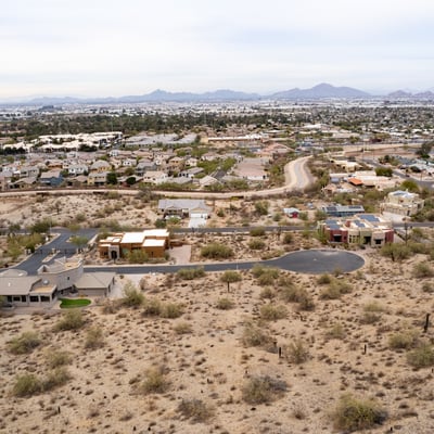 Featured aerial view of this spacious hillside lot showcasing elevated terrain and scenic desert beauty. Perfect for a luxury custom home near South Mountain Preserve and outdoor recreation.