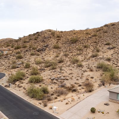Expansive desert hillside lot offering panoramic mountain scenery and surrounding luxury homes. Located in Phoenix, this elevated property provides the ideal setting for a private custom retreat.
