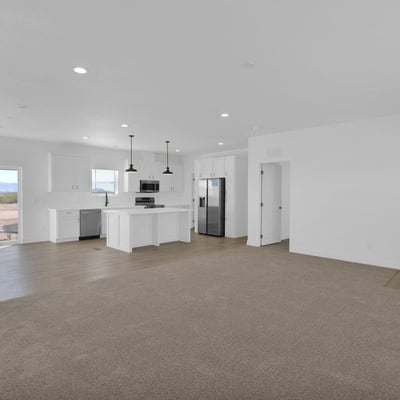 Open-concept great room designed for gathering and entertaining, featuring recessed lighting, expansive living space, and seamless connectivity to the kitchen. The layout creates an airy, welcoming environment filled with natural light.