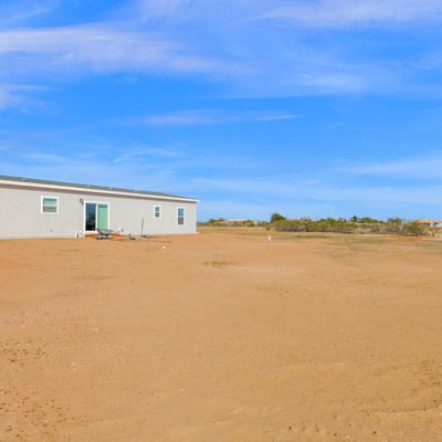 Vast outdoor surroundings provide privacy, scenic desert views, and exceptional flexibility for outdoor enjoyment. The expansive lot complements the home's modern design while embracing the peaceful Wittmann setting.