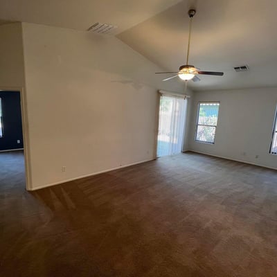 Spacious living area designed for comfort and functionality with abundant natural light and direct backyard access. The seamless layout supports both entertaining and everyday living.
