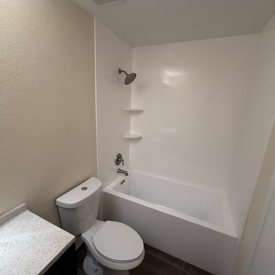 Clean and inviting full bathroom offering a tub and shower combination, updated vanity, and contemporary fixtures. Functional design meets everyday comfort while enhancing the home's move-in-ready appeal.