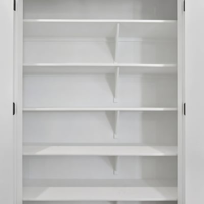 This generously sized pantry offers multiple built-in shelves to keep kitchen essentials organized while maximizing storage and convenience for everyday living.