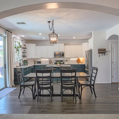 Open dining space that flows effortlessly into the updated kitchen and overlooks the backyard patio. Designed for easy entertaining and comfortable family gatherings.