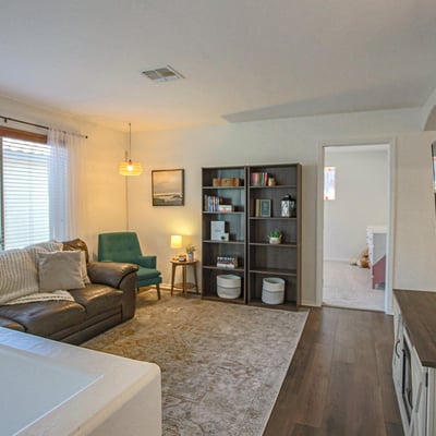 Inviting upstairs loft offering comfortable living space, abundant natural light, and flexible functionality for today's changing lifestyle needs.