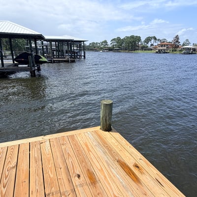 Waterfront property featuring a spacious dock, perfect for boating and enjoying scenic views.