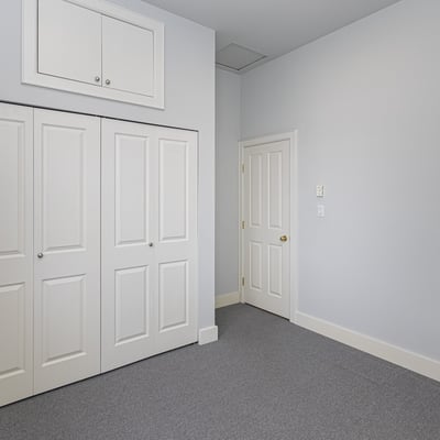 Bright, spacious room featuring built-in storage and a versatile layout, perfect for various living arrangements.