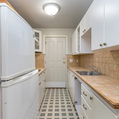 Bright and functional kitchen featuring ample counter space and convenient layout for everyday cooking.