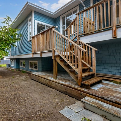 This property features a spacious deck, ideal for outdoor gatherings, and a low-maintenance yard.