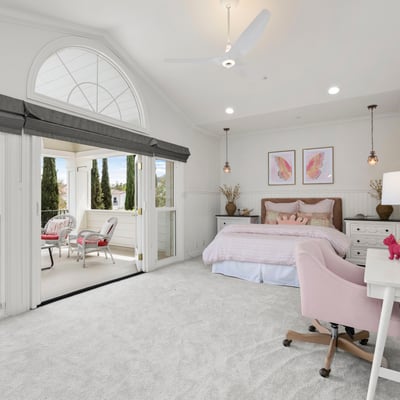 Bedroom 4-Bright and airy bedroom featuring a cozy sitting area, large windows, and modern furnishings with direct access to you own private front balcony.