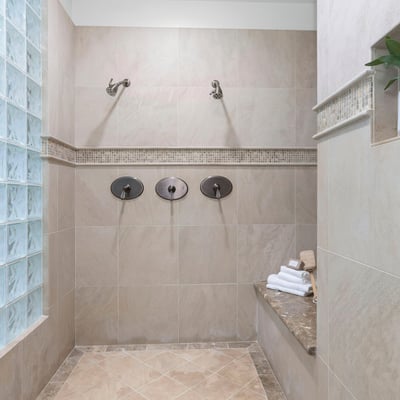 Primary Bathroom-Discover a spacious walk-in shower featuring dual showerheads and modern finishes, perfect for daily relaxation.