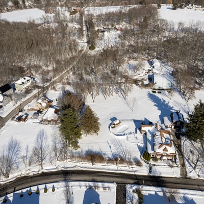 Expansive winter landscape featuring spacious lots and scenic views, perfect for your dream home development.