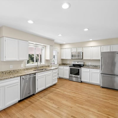 Spacious kitchen featuring modern appliances, ample counter space, and natural light for creative cooking experiences.