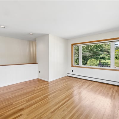 Bright and open living space featuring large windows and versatile layout, ideal for various design options.