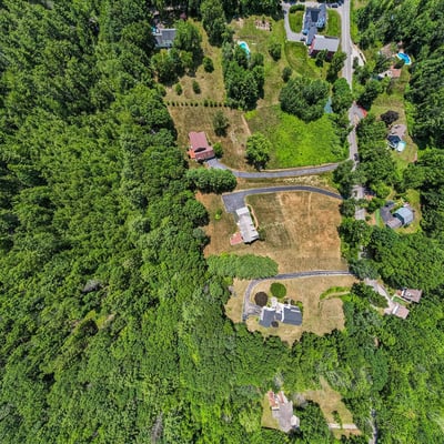 Expansive wooded lot with easy access to local amenities, perfect for private development or investment opportunities.