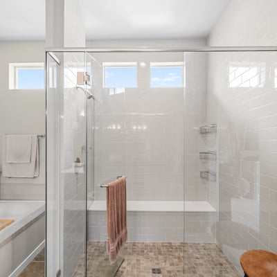 Primary Suite with attached 5 piece bath and walk in closet.