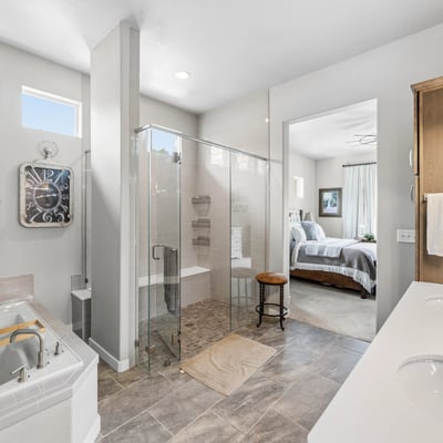 Primary Suite with attached 5 piece bath and walk in closet.