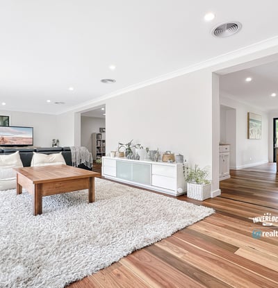 Bright and airy living space with natural light, featuring hardwood floors and an inviting, open layout.