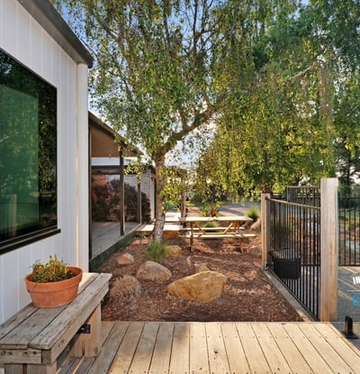 Modern outdoor space featuring a tranquil garden area, perfect for relaxation and entertaining.