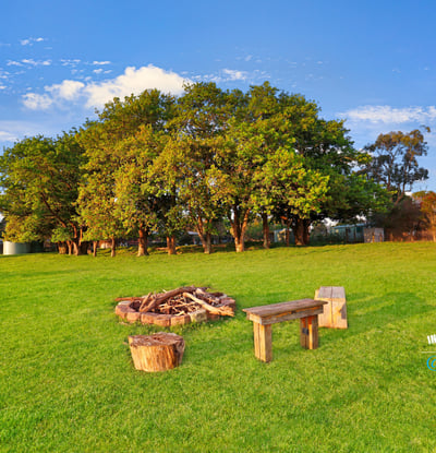 Expansive outdoor space featuring a cozy fire pit area, perfect for gatherings and relaxation.